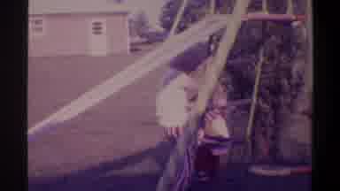 Gainsville Florida USA (1974): A Young Boy With Blond Hair Playing In The Yard