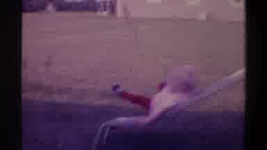 Gainsville Florida USA (1974): Toddler Laughs After Falling Onto The Grass After