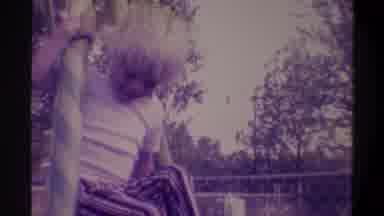Gainsville Florida USA (1974): A Child Playing On A Swing Set