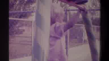 Gainsville Florida USA (1974): Young Small Child Playing On A Swing Set In A