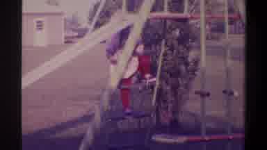 Gainsville Florida USA (1974): Small Child Climbing Up The Ladder Of A Backyard