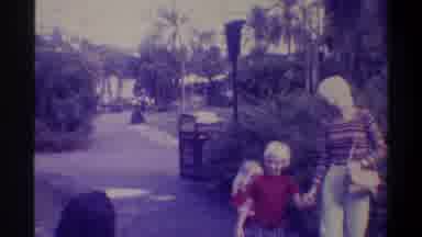 Gainsville Florida USA (1974): Two Young Children And Their Mom Walking Through A