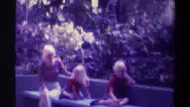 Gainsville Florida USA (1974): Family Sitting At A Bench Enjoying Their Time At A