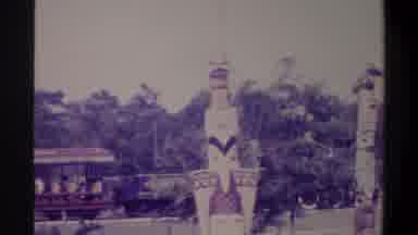Gainsville Florida USA (1974): A Train Rounds A Corner To Gaze At Painted Totem