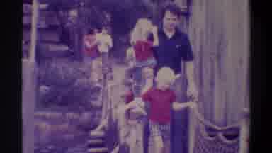 Gainsville Florida USA (1974): Man With Two Children Passing By A Swinging Bridge
