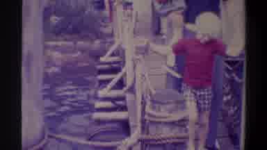 Gainsville Florida USA (1974): A Group Of People Walking On The Hanging Bridge