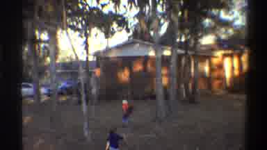 Gainsville Florida USA (1975): Three Kids Running Up A Yard To The Front Door Of A