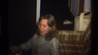 Gainsville Florida USA (1975): Woman Sitting On Plaid Sofa Eating Kids Dressed In