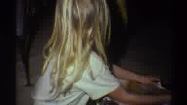 Gainsville Florida USA (1975): Girl Wearing White Shirt Open Christmas Gift