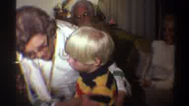 Gainsville Florida USA (1975): Grandma Hugs Her Blond Grandson Tightly In Front Of