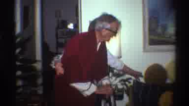 Gainsville Florida USA (1975): An Elderly Man Is Helped By A Cane And His Wife As