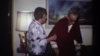 Gainsville Florida USA (1975): Old Man And Old Lady Wearing Glasses Talking Inside