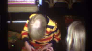 Gainsville Florida USA (1975): Kids A Boy And Girl Opening A Gift