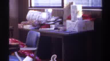 Gainsville Florida USA-1975: Piled Christmas Gifts In Wood-Paneled Room