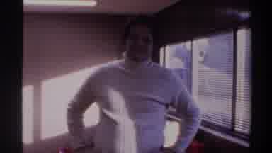 Gainsville Florida USA (1975): Male In White Turtleneck Shrugs And Shows Living