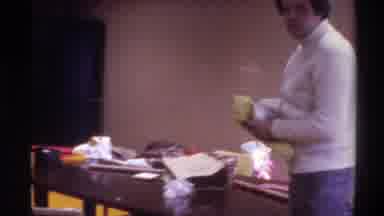 Gainsville Florida USA (1975): Man In A Hotel Room Packing His Suitcase With Two