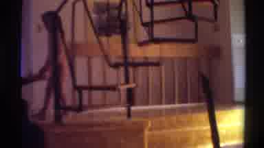 Gainsville Florida USA (1975): Mom Hugs Daughter Sitting On Floor Near Stairs In