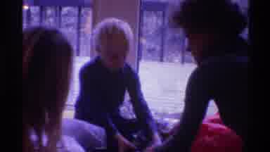 Gainsville Florida USA (1975): Three Siblings Open Their Gifts In Pajamas On
