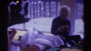 Gainsville Florida USA (1975): People Opening Presents Near A Christmas Tree And A