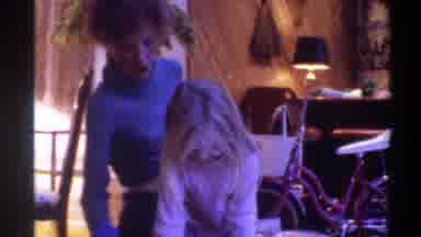 Gainsville Florida USA (1975): A Mother And A Daughter Doing Some Work At The Home
