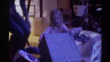 Gainsville Florida USA (1975): Little Girl Is Opening Presents For Either