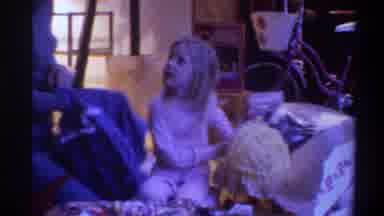 Gainsville Florida USA (1975): Little Girl Opened Her Gift Box While Her Mom