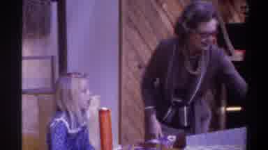 Gainsville Florida USA (1975): Grandma Showing Granddaughter Her Present And