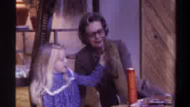 Gainsville Florida USA (1975): Grandmother Helps Granddaughter Open Her First