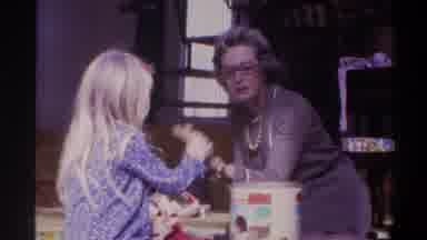 Gainsville Florida USA (1975): Older Woman Playing Wooden Block Game With Young