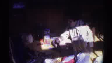 Gainsville Florida USA (1975): A Woman And Two Children Are Sitting Facing Each