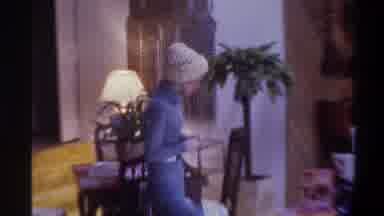 Gainsville Florida USA-1975: A Lady In A Blue Coat Bringing Something To A