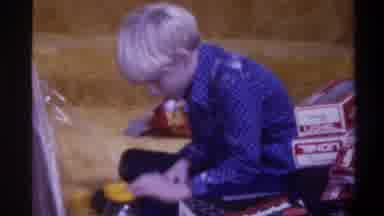Gainsville Florida USA (1975): A Small Boy Trying To Fix The Cap Of The Yellow