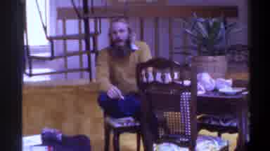 Gainsville Florida USA (1975): Man With A Long Beard In A Yellow Sweater Watches A