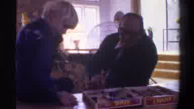 Gainsville Florida USA (1975): Older Man Glasses Playing Board Game With Young