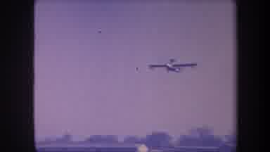 Volmer Yucaipa California USA (1959): View Of Plane Flying In Clear Sky Over Grass