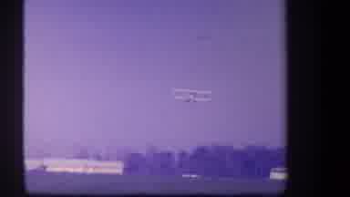 Volmer Yucaipa California USA (1959): A Plane Flies Over A Road