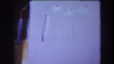 Volmer Yucaipa California USA-1964: Camera Pan Of A Cupboard Door With Six Holes