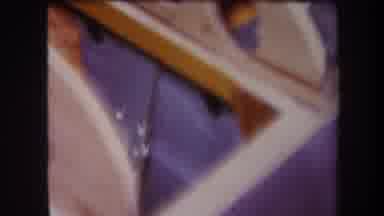 Volmer Yucaipa California USA (1964): Tan Wooden Object Frame Resting On A Blue