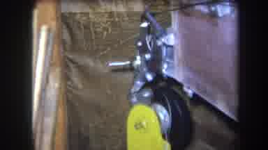 Volmer Yucaipa California USA-1964: Industrial Machine Component In Dark Corner With Yellow Lever