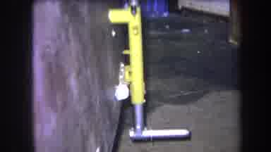 Volmer Yucaipa California USA (1964): A Yellow And Silver Metal Object Connected