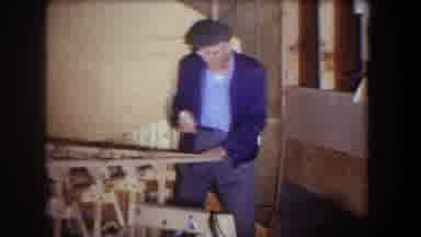 Volmer Yucaipa California USA (1965): Video Of A Man Wearing A Blue Jacket Working