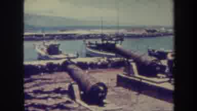 Honolulu Hawaii USA (1967): Tourist Sits Next To An Old Docking Yard Which Was