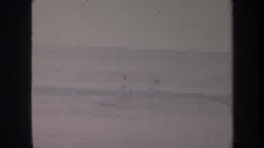 Honolulu Hawaii USA (1967): Two People Playing Water Waves Having Fun Time Wet