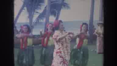Honolulu Hawaii USA (1967): Woman Adorned In Flowers And Line Of Hula Girls Dance