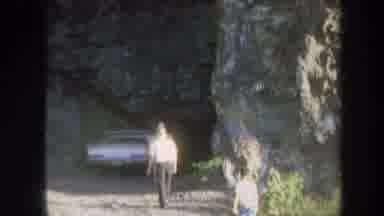 Honolulu Hawaii USA (1967): People Walking Towards A Car Parked Near A Cave