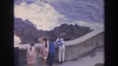 Honolulu Hawaii USA (1967): Tourist Family Watching Waves Breaking Over Rocky