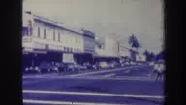 Honolulu Hawaii USA (1967): View Of A Car And Pedestrian On A City Street In A