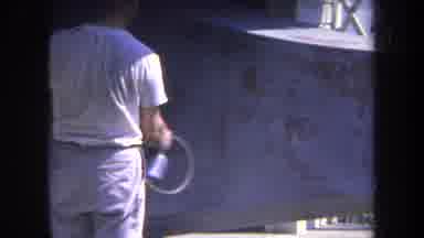 Volmer Yucaipa California USA (1969): Man Wearing White Shirt Spray Paints