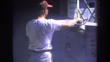 Volmer Yucaipa California USA (1969): Man In Glasses Spray Painting His Vehicle