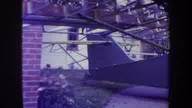 Volmer Yucaipa California USA (1969): Both Sides Of An Old Airplane Being Worked